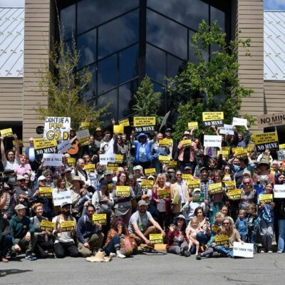 Group photo of Community Environmental Advocates carrying protest signs
